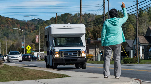 waving the bus to stop